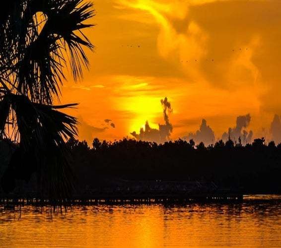 Sun setting the sky orange over Port Salerno, Florida