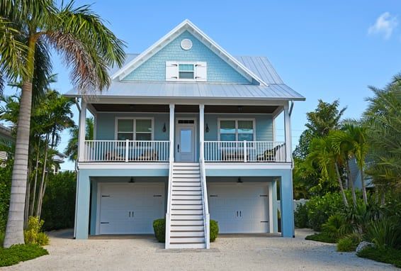 A smaller, blue, duplex home in Florida.