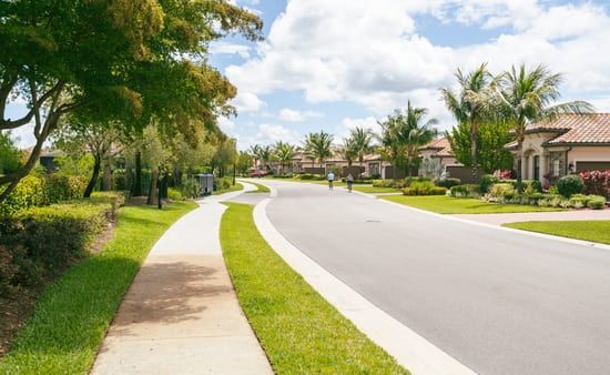 A beautiful stretch of road in a residential neighborhood in Palm Springs, FL.