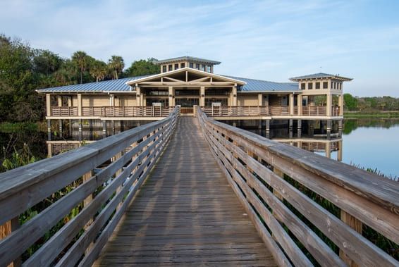 Boardwalk and visitor center at Green Cay Nature Center and Wetlands in Boynton Beach, Florida at sunrise.